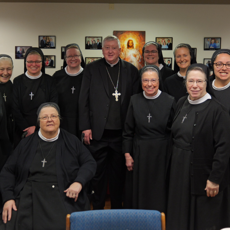 Archbishop Mitchell Rozanski with our Sister from the Archdiocese of St. Louis | Sisters of St. Francis of the Martyr St. George